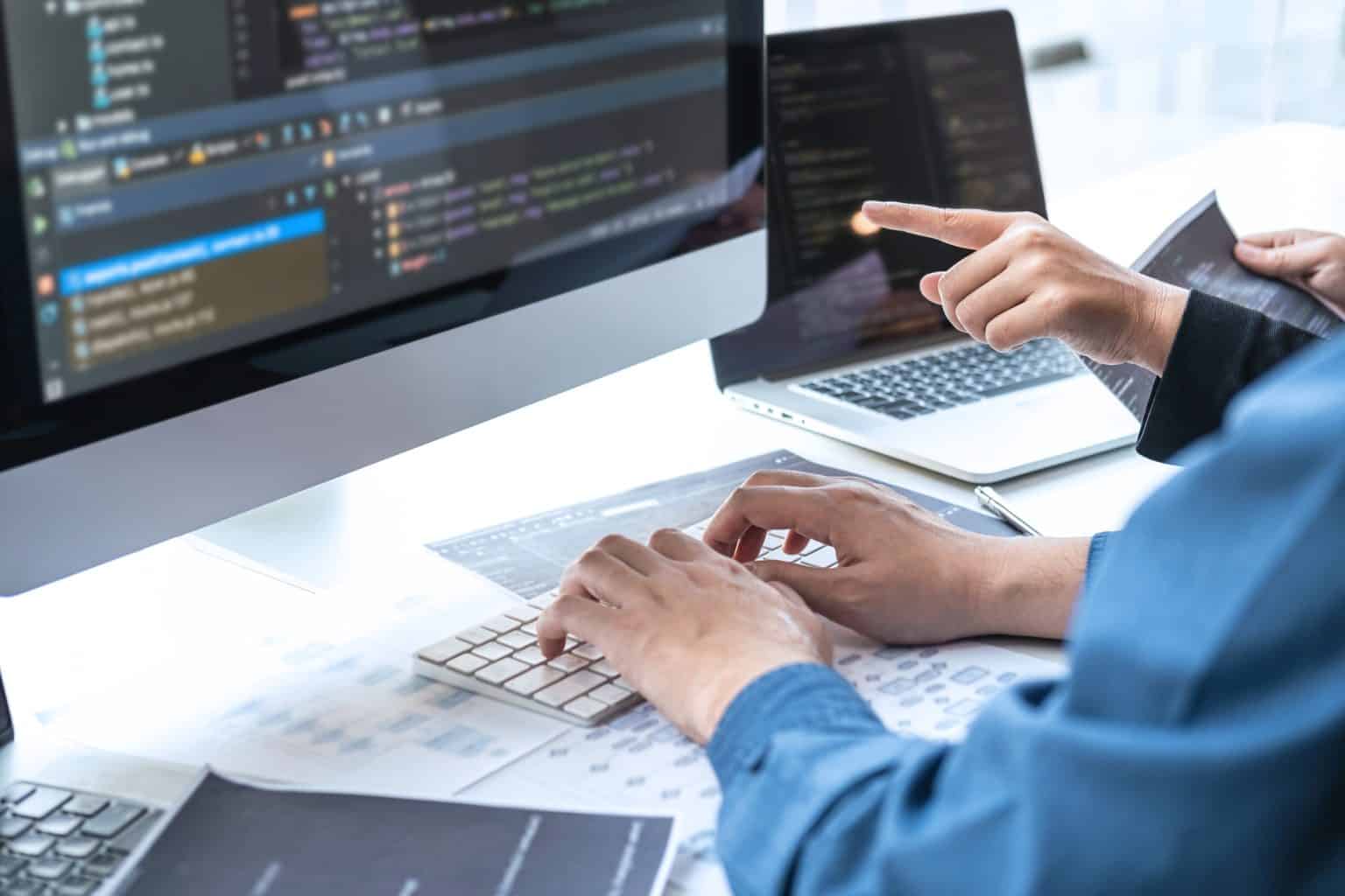 agency team working on web development on a desktop computer